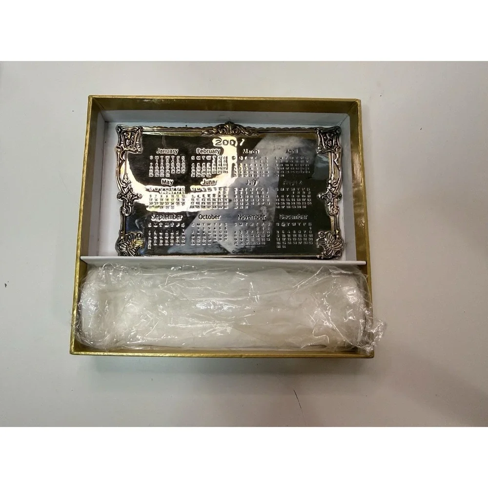Neiman‎ Marcus 2007 Bank Note Centennial Silver Tone Calendar Collectible